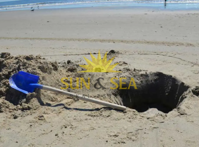 ¿Cuáles son los peligros de cavar hoyos en la playa?